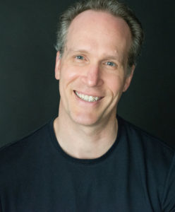 Author Bill Kenower in black shirt
